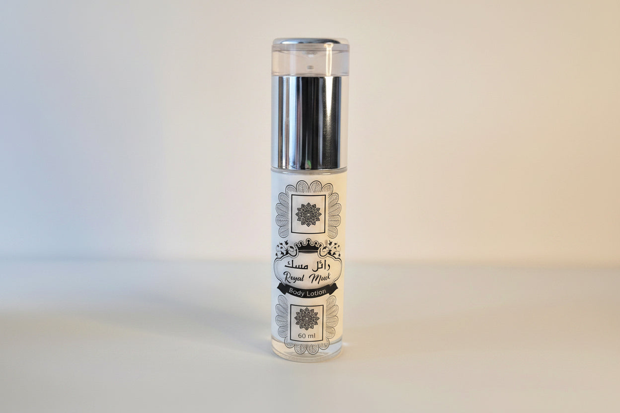 Clear glass bottle with a decorative label on a light gray background